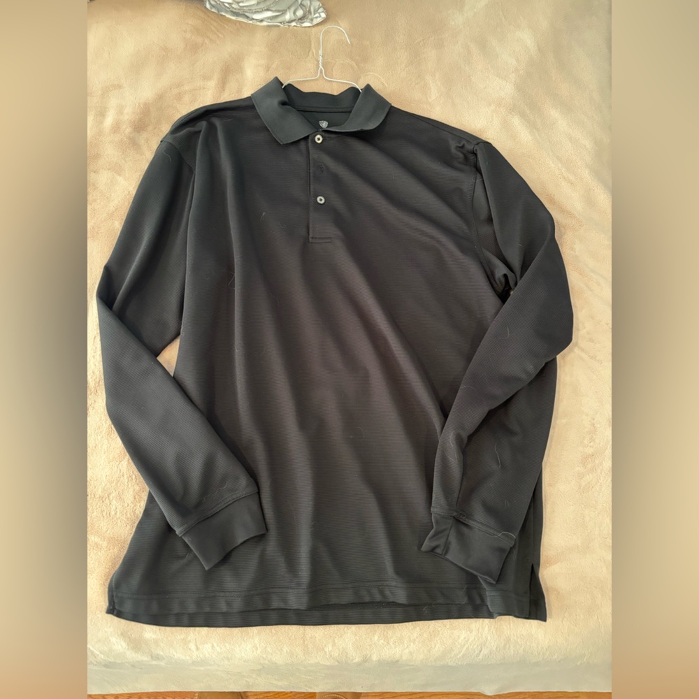 Pro tour long sleeve collared golf shirt in black. Men’s XL.